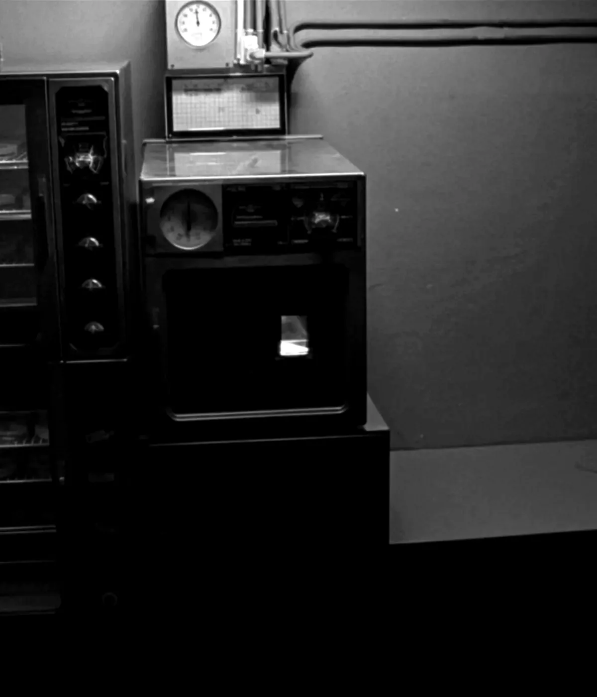 A stack of laboratory incubators with glass doors, a temperature dial and a chart recorder on the side.